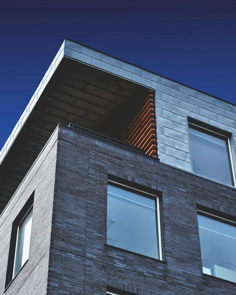 Contemporary Condo with Large Windows and Metal Facade