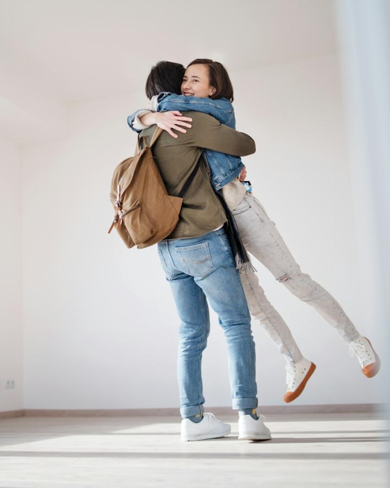 Couple Embracing in a New Home