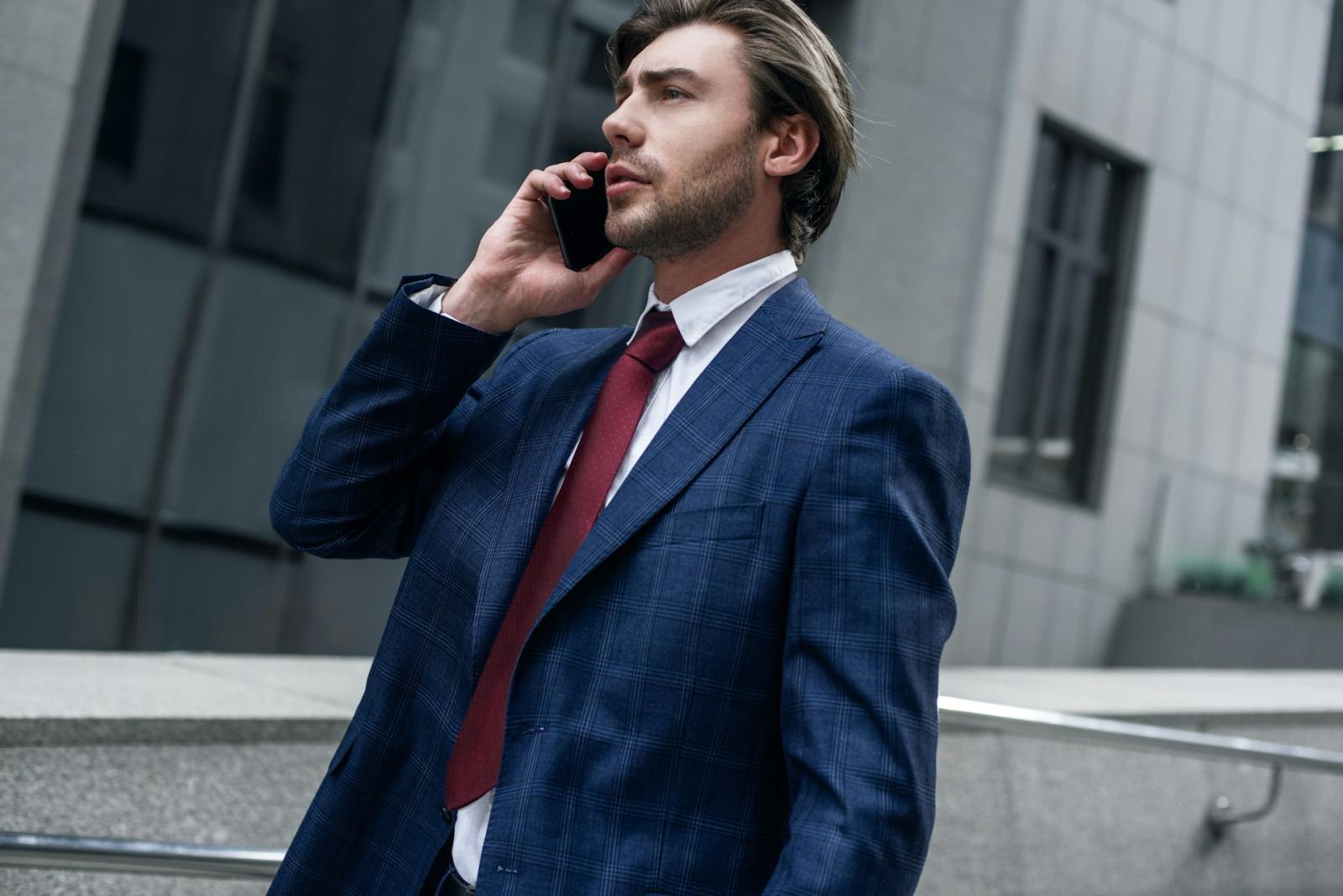 Realtor speaking on a cell phone, symbolizing an organized and stress-free relocation process.