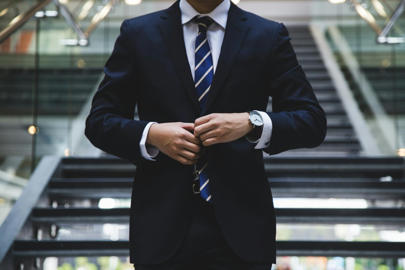 A commercial real estate expert dressed in a formal suit, symbolizing professional investment expertise.
